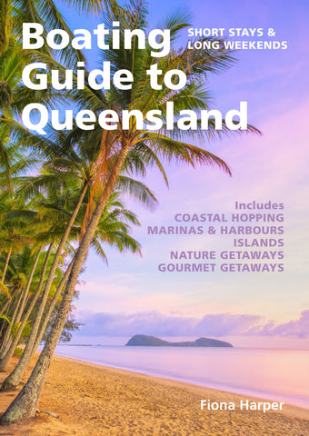 Book cover of 'Boating Guide to Queensland' with palm trees and beach.