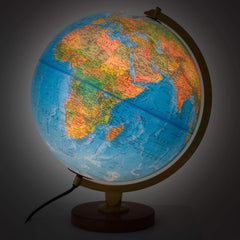 Globe with a glowing base on a dark background